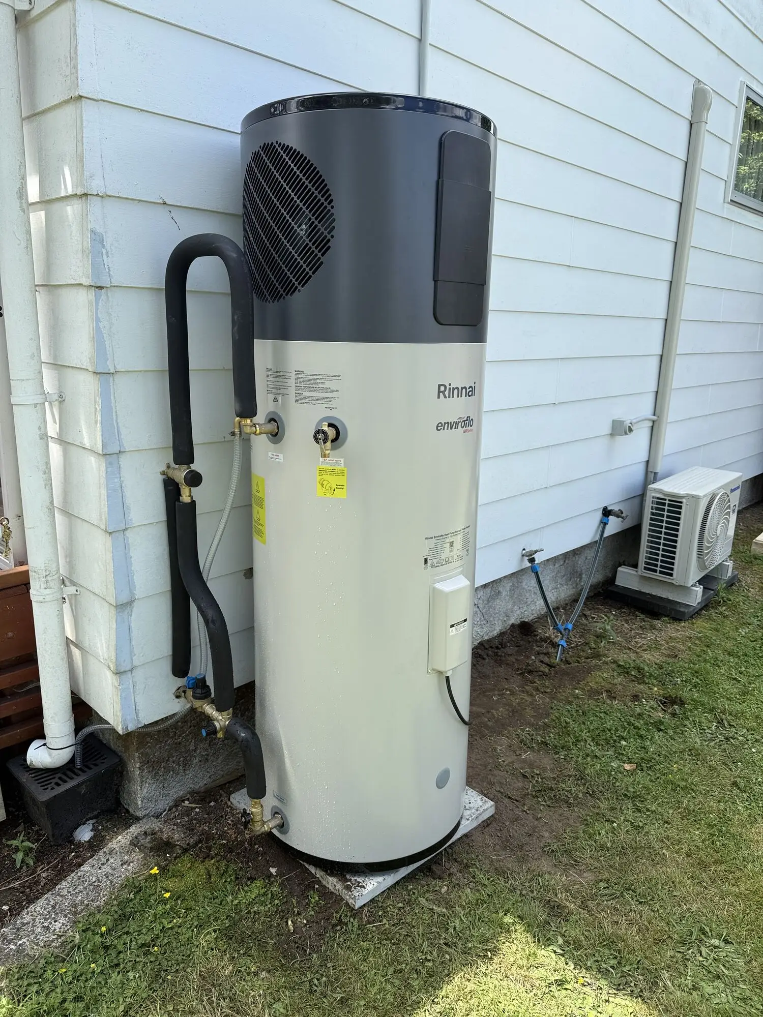 Rinnai Enviroflo hot water heat pump we installed outside, the kind of system a conversion puts in