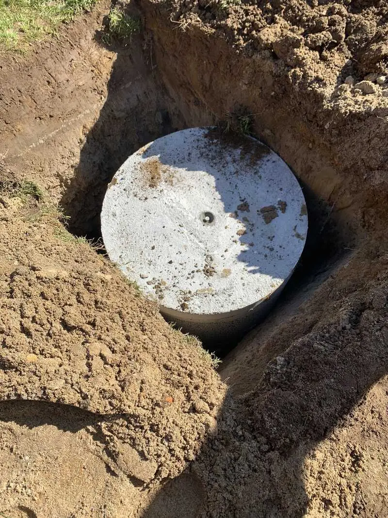 Septic tank set in the ground and connected by Tron Plumbing near Ngaruawahia