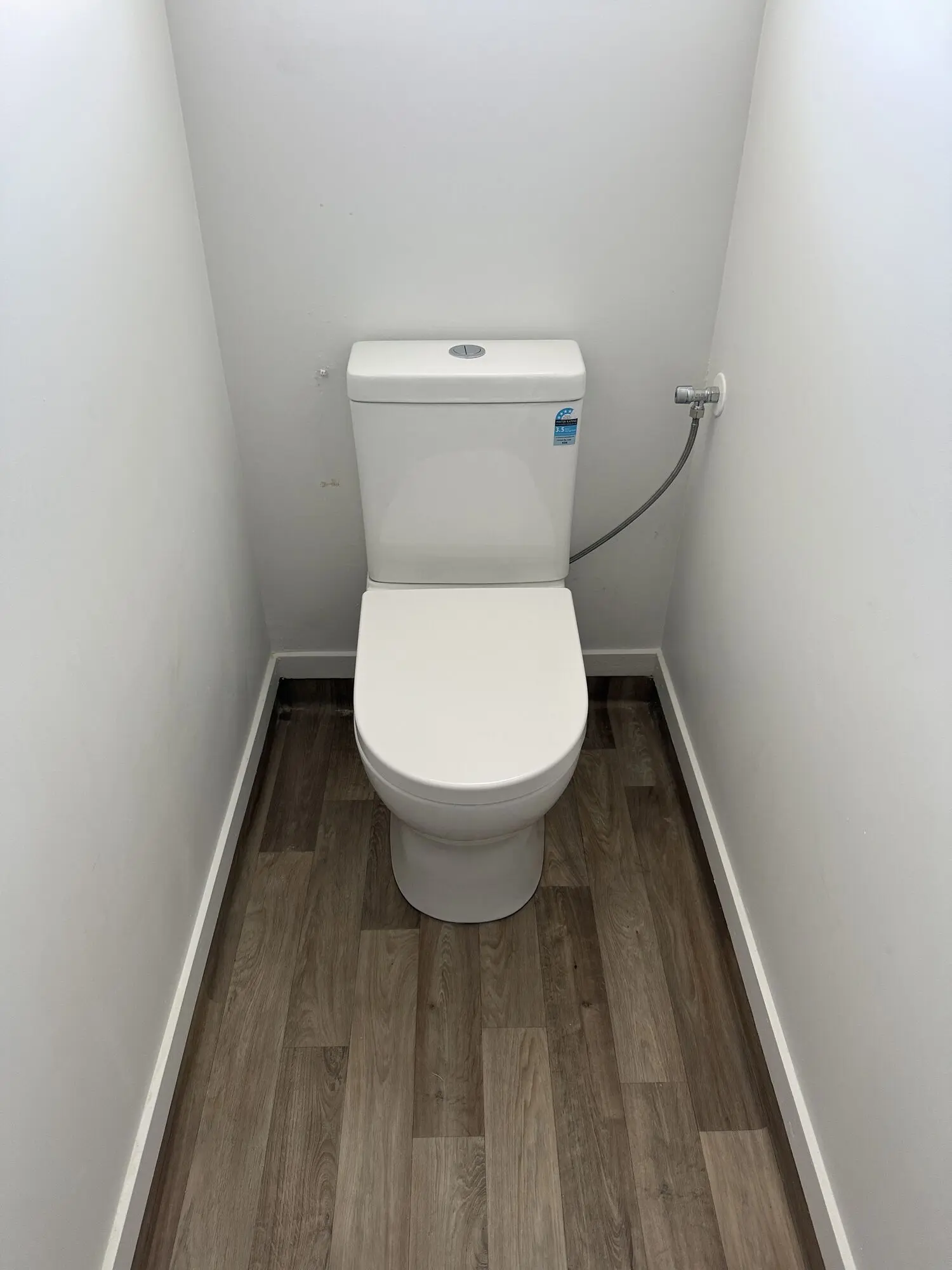 New close-coupled toilet we installed in a separate toilet room